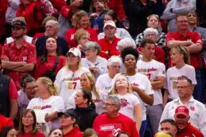 The Murray family wearing shirts with a yellow 2 and a red 7 for Nebraska Cornhusker Harper Murray (27) and Michigan Wolverine Kendall Murray (27) during the volleyball match on Friday, November 17, 2023, in Lincoln, Nebraska. Photo by John S. Peterson.