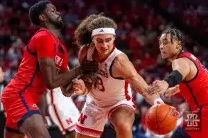 Nebraska Cornhusker forward Josiah Allick (53) fights for the ball against Stony Brook Seawolf forward Chris Maidoh (4) and guard Aaron Clarke (5) in the first half during the basketball game on Wednesday, November 15, 2023, in Lincoln, Nebraska. Photo by John S. Peterson.