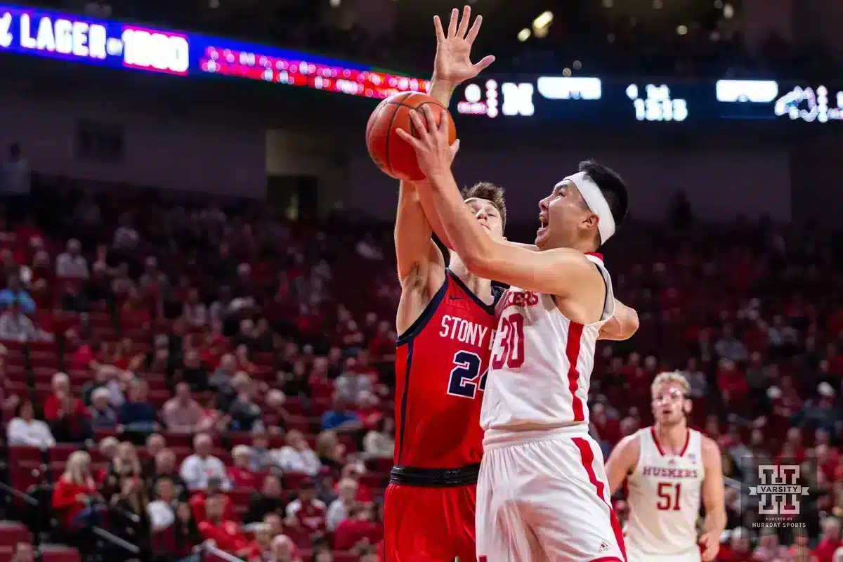 JP231115_MBB_NU_v_SB_1908_WM.jpg Nebraska Cornhusker guard Keisei Tominaga (30) drives to the basket against Stony Brook Seawolf guard Jared Frey (24) in the first half during the basketball game on Wednesday, November 15, 2023, in Lincoln, Nebraska. Photo by John S. Peterson.