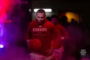 Nebraska Cornhusker guard C.J. Wilcher (0) leads the Huskers out against the Stony Brook Seawolves during the basketball game on Wednesday, November 15, 2023, in Lincoln, Nebraska. Photo by John S. Peterson.