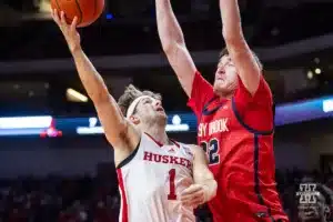 Nebraska Cornhusker guard Sam Hoiberg (1) puts a layup against Stony Brook Seawolf center Keenan Fitzmorris (32) in the second half during the basketball game on Wednesday, November 15, 2023, in Lincoln, Nebraska. Photo by John S. Peterson.