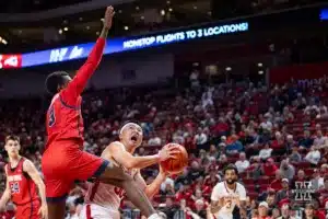 Nebraska Cornhusker guard Keisei Tominaga (30) drive to the basket against Stony Brook Seawolf guard Toby Onyekonwu (3) in the second half during the basketball game on Wednesday, November 15, 2023, in Lincoln, Nebraska. Photo by John S. Peterson.