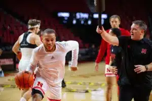 Nebraska Cornhusker guard C.J. Wilcher (0) makes a layup warming up for Florida A
