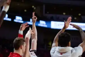 Nebraska Cornhusker bench celebrates a three point shot against the Florida A