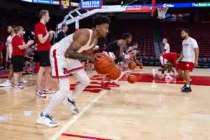 Nebraska Cornhusker guard Jamarques Lawrence (10) dribbles two basketballs in warm-ups against the Rider Broncs during the basketball game on Monday, November 13, 2023, in Lincoln, Nebraska. Photo by John S. Peterson.