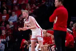 Nebraska Cornhusker forward Rienk Mast (51) cheers on his teammates from the bench against the Rider Broncs in the first half during the basketball game on Monday, November 13, 2023, in Lincoln, Nebraska. Photo by John S. Peterson.