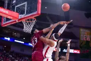 Nebraska Cornhusker guard Jarron Coleman (9) tries to make a layup against Rider Bronc forward Tariq Ingraham (33) in the first half during the basketball game on Monday, November 13, 2023, in Lincoln, Nebraska. Photo by John S. Peterson.