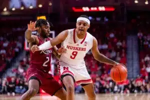 Nebraska Cornhusker guard Jarron Coleman (9) dribbles the ball against Rider Bronc guard Allen Powell (2) in the first half during the basketball game on Monday, November 13, 2023, in Lincoln, Nebraska. Photo by John S. Peterson.