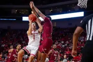 Nebraska Cornhusker guard Sam Hoiberg (1) drives to the lane against Rider Bronc forward Tariq Ingraham (33) in the second half during the basketball game on Monday, November 13, 2023, in Lincoln, Nebraska. Photo by John S. Peterson.