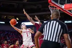 Nebraska Cornhusker guard Sam Hoiberg (1) makes a layup against Rider Bronc forward Tariq Ingraham (33) in the seond half during the basketball game on Monday, November 13, 2023, in Lincoln, Nebraska. Photo by John S. Peterson.