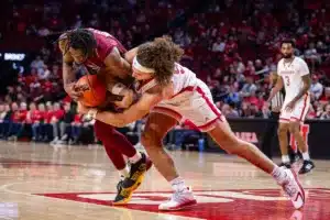 Nebraska Cornhusker forward Josiah Allick (53) fights for the ball against Rider Bronc Tyriek Weeks in the second half during the basketball game on Monday, November 13, 2023, in Lincoln, Nebraska. Photo by John S. Peterson.