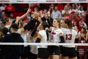 Nebraska Cornhusker huddle to celebrate their win over the Illinois Fighting Illini in four sets during the volleyball match on Sunday, November 12, 2023, in Lincoln, Nebraska. Photo by John S. Peterson.