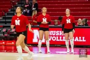 Nebraska Cornhusker Maisie Boesiger (7) and Nebraska Cornhusker Laney Choboy (6) watch Nebraska Cornhusker Lexi Rodriguez (8) during warm-ups before taking on the Illinois Fighting Illini in a volleyball match on Sunday, November 12, 2023, in Lincoln, Nebraska. Photo by John S. Peterson.