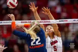 Nebraska Cornhusker Bekka Allick (5) jumps to block a shot by Illinois Fighting Illini Brooke Mosher (22) in the fourth set  during the volleyball match on Sunday, November 12, 2023, in Lincoln, Nebraska. Photo by John S. Peterson.