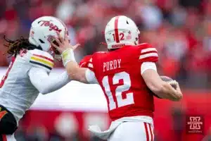 Nebraska Cornhusker quarterback Chubba Purdy (12) still-arms Maryland Terrapin defensive back Ja'Quan Sheppard (3) in the fourth quarter during the football game on Saturday, November 11, 2023, in Lincoln, Nebraska. Photo by John S. Peterson.