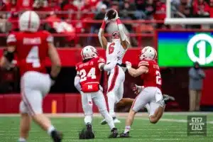 Maryland Terrapin wide receiver Jeshaun Jones (6) makes a catch against Nebraska Cornhusker defensive back Marques Buford Jr. (24) and defensive back Isaac Gifford (2) in the second quarter during the football game on Saturday, November 11, 2023, in Lincoln, Nebraska. Photo by John S. Peterson.