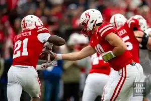 Nebraska Cornhusker quarterback Heinrich Haarberg (10) hands the ball off to running back Emmett Johnson (21) in the second quarter agaisnt the Maryland Terrapins during the football game on Saturday, November 11, 2023, in Lincoln, Nebraska. Photo by John S. Peterson.