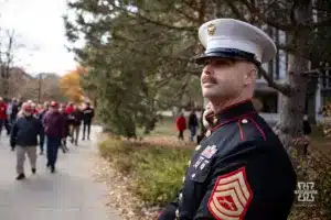 A Marine collect for Toys for Tots before the football game against the Maryland Terrapins on Saturday, November 11, 2023, in Lincoln, Nebraska. Photo by John S. Peterson.