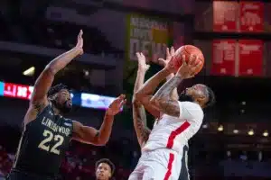 Nebraska Cornhuskers guard Brice Williams (3) makes a basket against Lindenwood Lion forward Isaac Ondekane (22) in the first half during a college basketball game on Monday, November 6, 2023, in Lincoln, Nebraska. Photo by John S. Peterson.