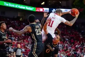 Nebraska Cornhuskers guard Eli Rice (11) grabs the rebound against the Lindenwood Lions forward David Ware (0) and guard Darius Beane (25) in the first half during a college basketball game on Monday, November 6, 2023, in Lincoln, Nebraska. Photo by John S. Peterson.