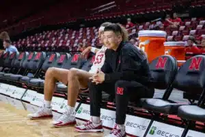 Nebraska Cornhuskers guard Keisei Tominaga (30) still out with an injury, sitting with Nebraska Cornhuskers forward Josiah Allick (53) before the game against the Lindenwood Lions on Monday, November 6, 2023, in Lincoln, Nebraska. Photo by John S. Peterson.
