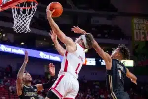 Nebraska Cornhuskers guard Sam Hoiberg (1) makes a layup against Lindenwood Lion guard Colin Ruffin (1) in the first half during a college basketball game on Monday, November 6, 2023, in Lincoln, Nebraska. Photo by John S. Peterson.