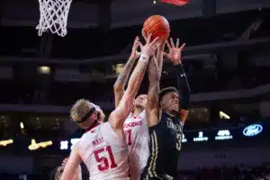 Nebraska Cornhuskers guard Eli Rice (11) and forward Rienk Mast (51) go for a rebound against Lindenwood Lion guard Tommie Williams (3) in the second half during a college basketball game on Monday, November 6, 2023, in Lincoln, Nebraska. Photo by John S. Peterson.