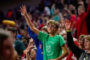 Nebraska Cornhusker fans holding their hands to volunteer for Tori Boggs performance before the Huskers take on the Northwestern State Lady Demons during a college basketball game on Monday, November 6, 2023, in Lincoln, Nebraska. Photo by John S. Peterson.