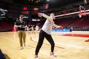 Nebraska Cornhuskers guard Allison Weidner (3) throws a t-shirt to the crowd of young fans before the game against the Northwestern State Lady Demons during a college basketball game on Monday, November 6, 2023, in Lincoln, Nebraska. Photo by John S. Peterson.
