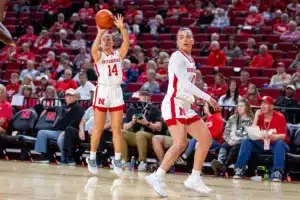 Nebraska Cornhuskers guard Callin Hake (14) makes a three-point shot against the Northwestern State Lady Demons in the third quarter during a college basketball game on Monday, November 6, 2023, in Lincoln, Nebraska. Photo by John S. Peterson.