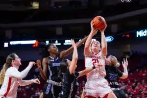 Nebraska Cornhuskers forward Annika Stewart (21) tries to put up a layup against Northwestern State Lady Demons forward Jasmin Dixon (11) and guard Carla Celaya (15) during a college basketball game on Monday, November 6, 2023, in Lincoln, Nebraska. Photo by John S. Peterson.