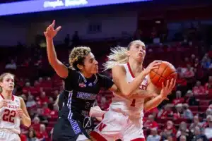 Nebraska Cornhuskers guard Jaz Shelley (1) fouled by Northwestern State Lady Demons guard Jiselle Woodson (3) going for a layup in the fourth quarter during a college basketball game on Monday, November 6, 2023, in Lincoln, Nebraska. Photo by John S. Peterson.