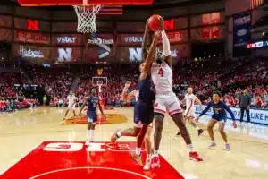 Nebraska Cornhusker forward Juwan Gary (4) grabs the rebound against South Carolina State Bulldog forward Davion Everett (55) in the first half during a college basketball game on Friday, December 29, 2023, in Lincoln, Nebraska. Photo by John S. Peterson.