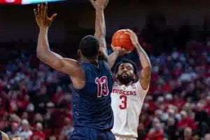 Nebraska Cornhusker guard Brice Williams (3) makes a three against South Carolina State Bulldog center Drayton Jones (13) in the second half during a college basketball game on Friday, December 29, 2023, in Lincoln, Nebraska. Photo by John S. Peterson.