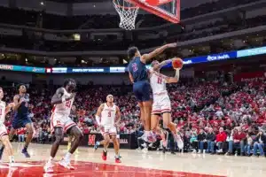 Nebraska Cornhusker guard Eli Rice (11) goes up for a layup against South Carolina State Bulldog guard Jordan Simpson (2) in the second half during a college basketball game on Friday, December 29, 2023, in Lincoln, Nebraska. Photo by John S. Peterson.