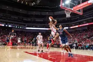 Nebraska Cornhusker guard Jarron Coleman (9) on a fast break layup against South Carolina State Bulldog guard Shaman Alston (24) in the second half during a college basketball game on Friday, December 29, 2023, in Lincoln, Nebraska. Photo by John S. Peterson.