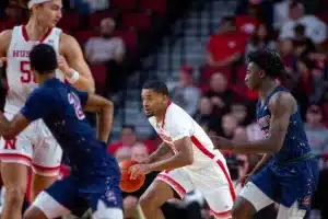 Nebraska Cornhusker guard Jamarques Lawrence (10) dribbles the ball down the court against the South Carolina State Bulldogs during a college basketball game on Friday, December 29, 2023, in Lincoln, Nebraska. Photo by John S. Peterson.