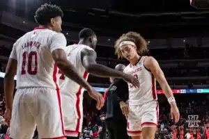 Nebraska Cornhusker forward Josiah Allick (53) gives five to forward Juwan Gary (4) and guard Jamarques Lawrence (10) after the win over the North Dakota Fighting Hawks during a college basketball game Wednesday, December 20, 2023, in Lincoln, Nebraska. Photo by John S. Peterson.