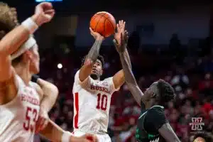 Nebraska Cornhusker guard Jamarques Lawrence (10) makes a jumper against North Dakota Fighting Hawk forward B.J. Omot (20) in the second half during a college basketball game Wednesday, December 20, 2023, in Lincoln, Nebraska. Photo by John S. Peterson.