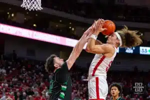 Nebraska Cornhusker forward Josiah Allick (53) is blocked by North Dakota Fighting Hawk forward Tsotne Tsartsidze (10) in the first half during a college basketball game Wednesday, December 20, 2023, in Lincoln, Nebraska. Photo by John S. Peterson.