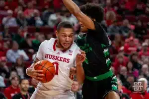 Nebraska Cornhusker guard C.J. Wilcher (0) dribbles the ball against North Dakota Fighting Hawk guard Tyree Ihenacho (4) in the first half during a college basketball game Wednesday, December 20, 2023, in Lincoln, Nebraska. Photo by John S. Peterson.