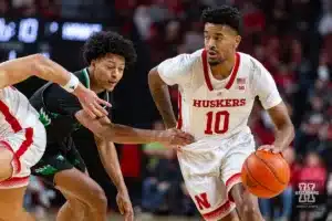 Nebraska Cornhusker guard Jamarques Lawrence (10) dribbles around North Dakota Fighting Hawk guard Tyree Ihenacho (4) in the first half during a college basketball game Wednesday, December 20, 2023, in Lincoln, Nebraska. Photo by John S. Peterson.