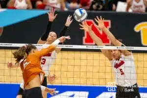 Nebraska Cornhusker outside hitter Merritt Beason (13) and Nebraska Cornhusker middle blocker Bekka Allick (5) blocks a shot form Texas Longhorn outside hitter Madisen Skinner (6) in the first set during the NCAA Finals on Sunday, December 17, 2023, in Tampa, Florida. Photo by John S. Peterson.