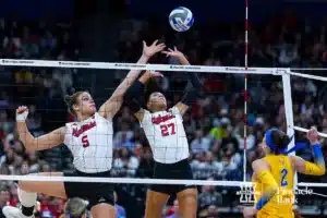 Nebraska Cornhusker middle blocker Bekka Allick (5) and Harper Murray jump to block a spike from Pittsburgh Panther outside hitter Valeria Vazquez Gomez (2) in the third set during the NCAA Semi-Finals, Thursday, December 14, 2023, Tampa, Florida. Photo by John S. Peterson.
