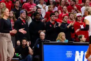 Nebraska Cornhuskers football players watching the match against the Georgia Tech Yellow Jackets during the third round in the NCAA Volleyball Championship match Thursday, December 7, 2023, Lincoln, Neb. Photo by John S. Peterson.