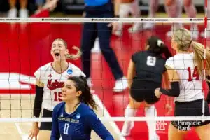 Nebraska Cornhusker Andi Jackson (15) celebrate a block against Georgia Tech Yellow Jacket Larissa Mendes (11) in the first set during the third round in the NCAA Volleyball Championship match Thursday, December 7, 2023, Lincoln, Neb. Photo by John S. Peterson.
