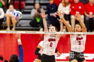 Nebraska Cornhuskers Bergen Reilly (2) and Bekka Allick (5) jump to block a shot from the Georgia Tech Yellow Jackets in the third set during the third round in the NCAA Volleyball Championship match Thursday, December 7, 2023, Lincoln, Neb. Photo by John S. Peterson.