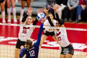 Nebraska Cornhusker Andi Jackson (15) and Nebraska Cornhusker Harper Murray (27) block a shot from Georgia Tech Yellow Jacket Leia Harper (12) in the second set during the third round in the NCAA Volleyball Championship match Thursday, December 7, 2023, Lincoln, Neb. Photo by John S. Peterson.