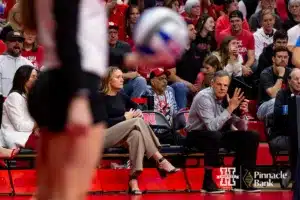 Nebraska Cornhusker head coach John Cook gives a signal to Nebraska Cornhusker Laney Choboy (6) before serving against the Georgia Tech Yellow Jackets in the first set during the third round in the NCAA Volleyball Championship match Thursday, December 7, 2023, Lincoln, Neb. Photo by John S. Peterson.