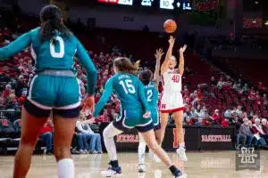 Nebraska Cornhusker center Alexis Markowski (40) makes a three point shot against UNC Wilmington Seahawk guard Taylor Henderson (2) in the first half during a college basketball game Tuesday, December 5, 2023, in Lincoln, Neb. Photo by John S. Peterson.